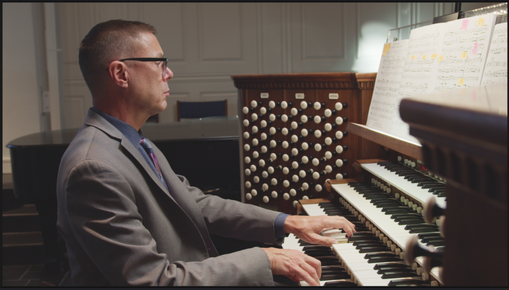 Christopher playing the organ